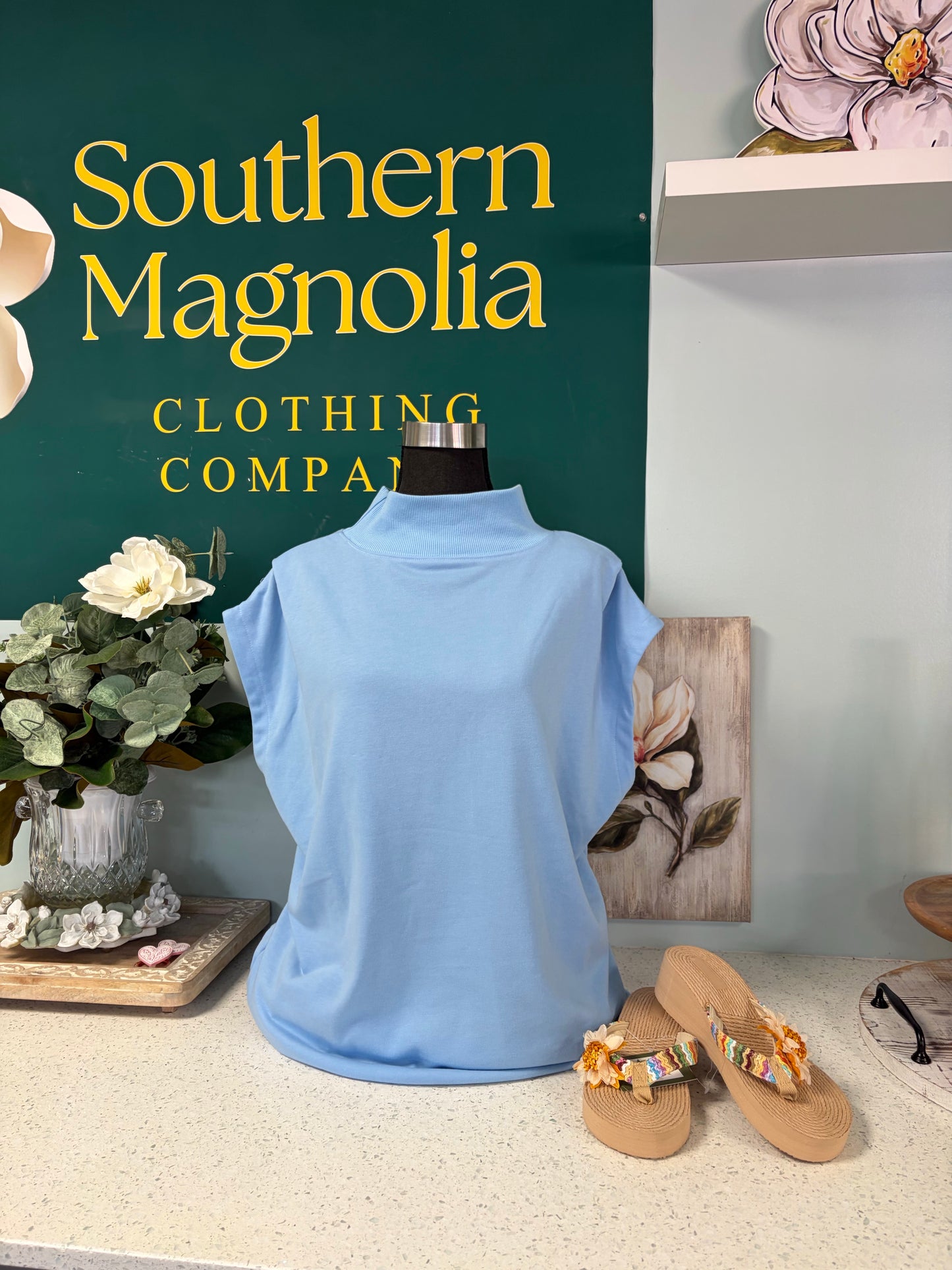 blue sleeveless mockneck