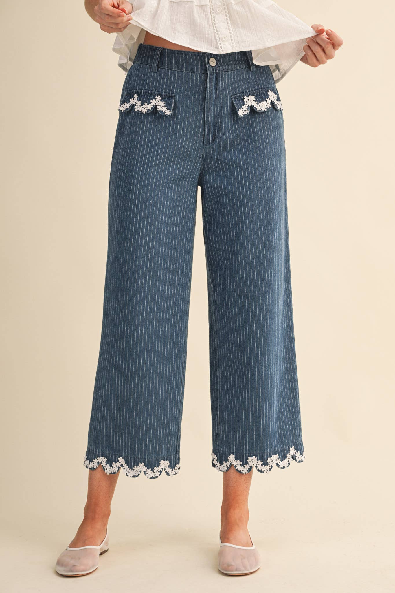 denim jeans with scalloped floral pockets
